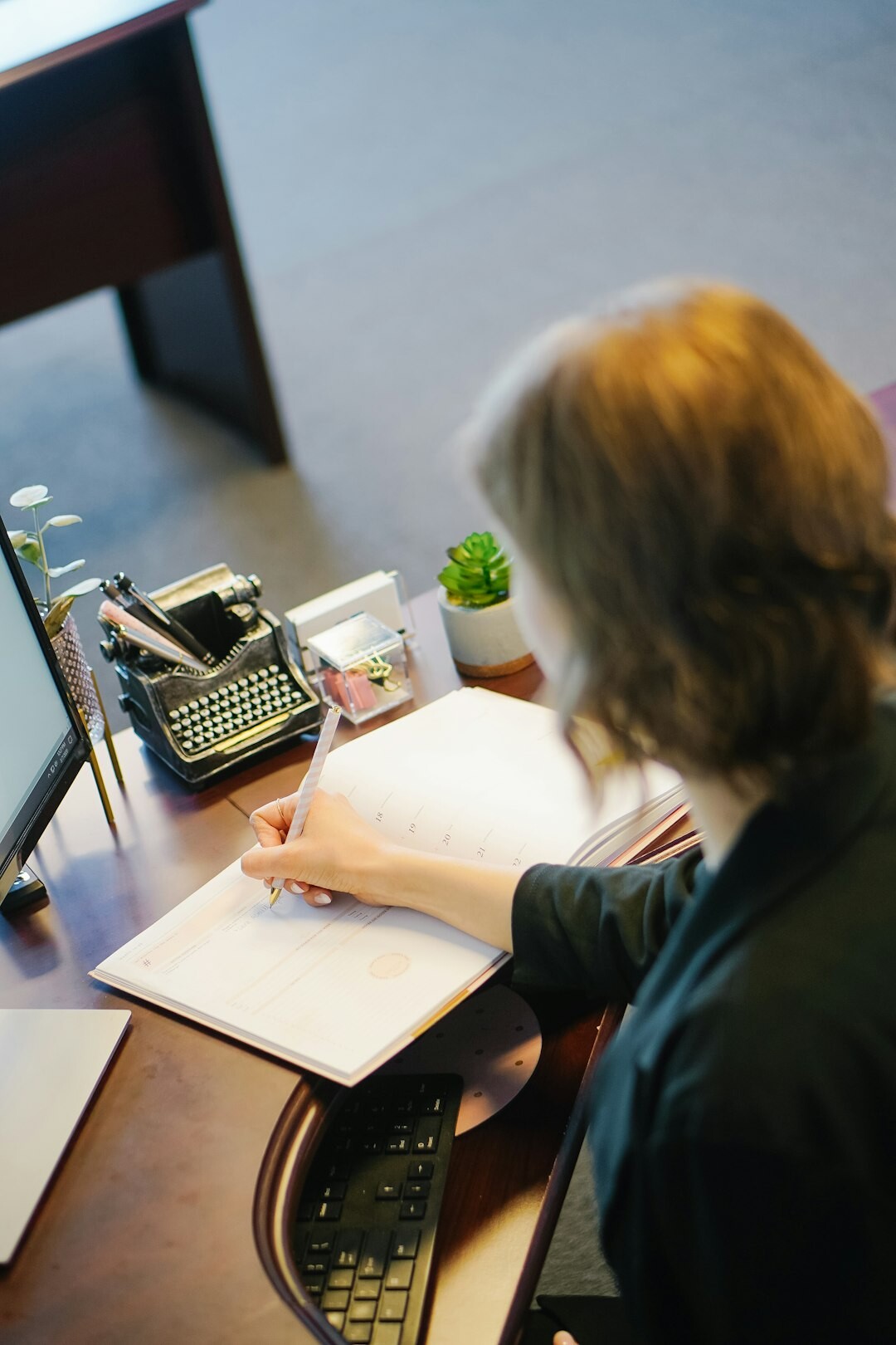 writer at desk with papers