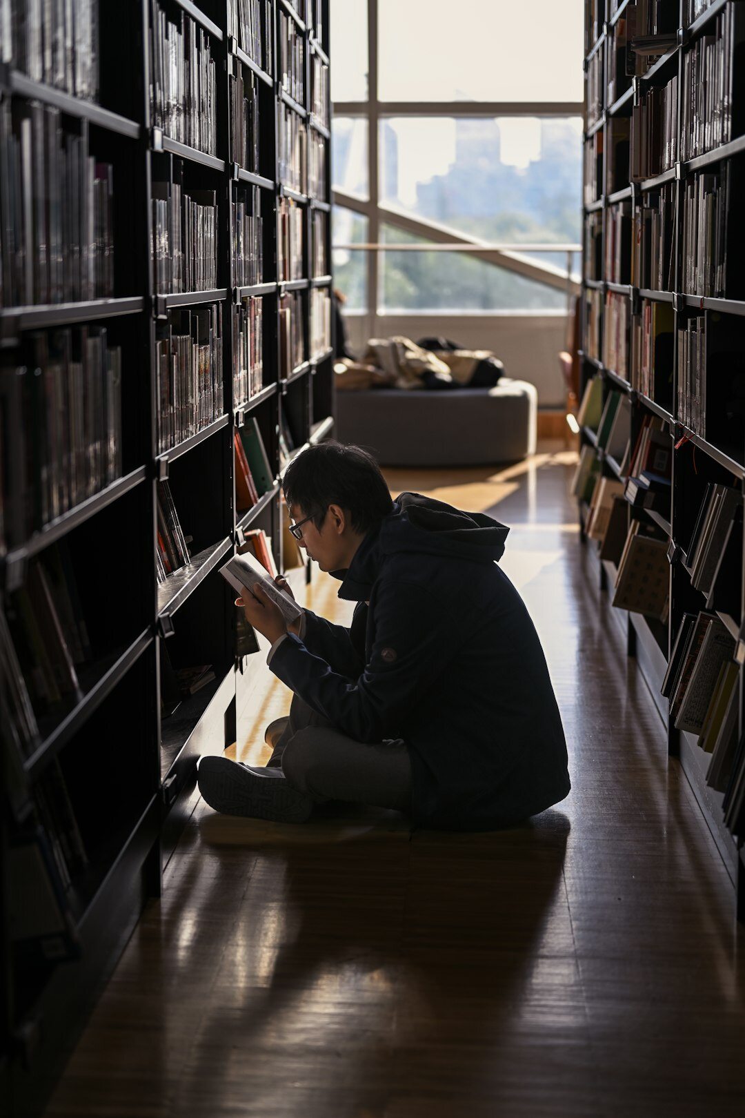 mystery writer taking notes in library